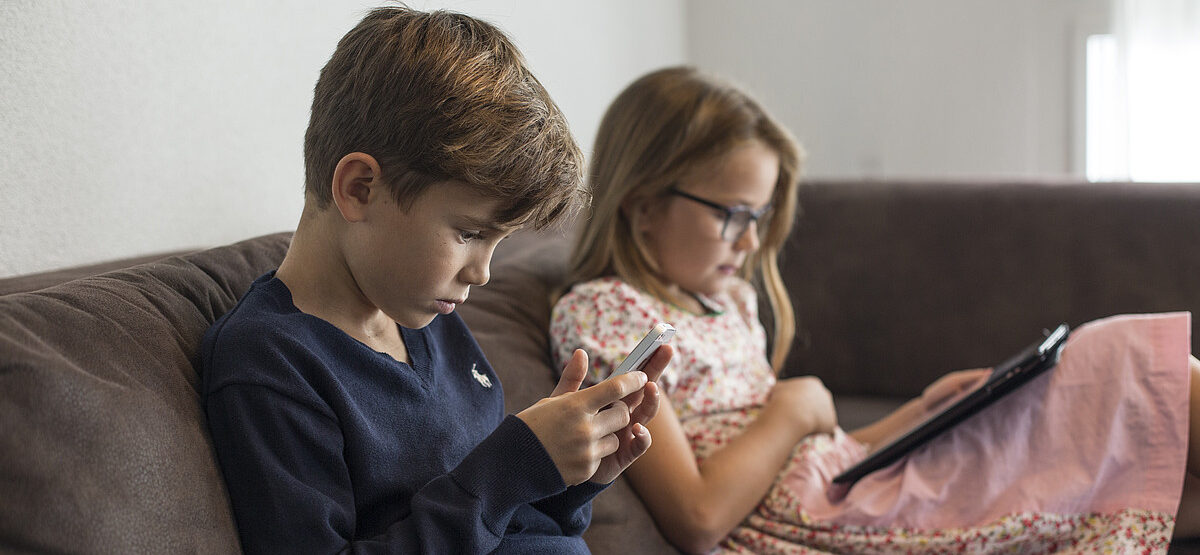 Kids with smartphone and tablet